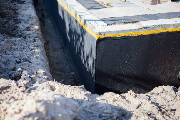 Professional Waterproofing technician working in Commack, NY